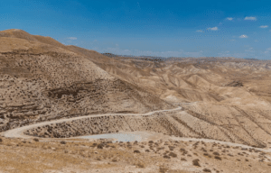 winding road through desert wilderness symbolizing the call to repentance and preparation