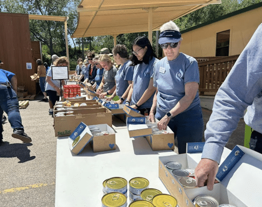 Coker Methodist Church volunteers organizing canned goods for the food pantry in San Antonio.